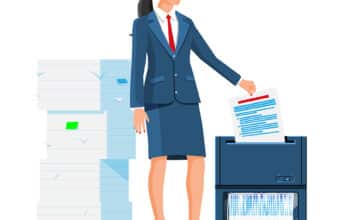 Office Worker Shredding Documents